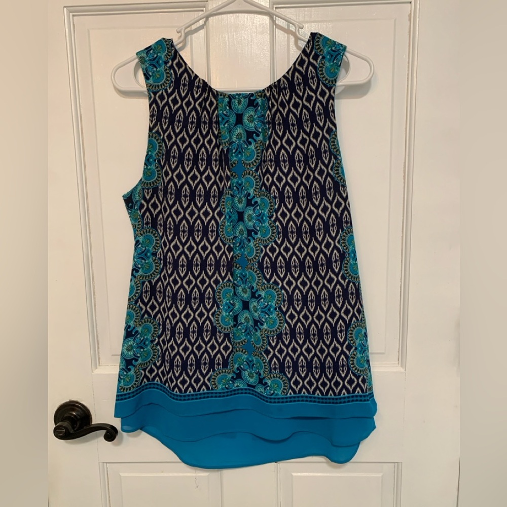 Dressy swing sleeveless top